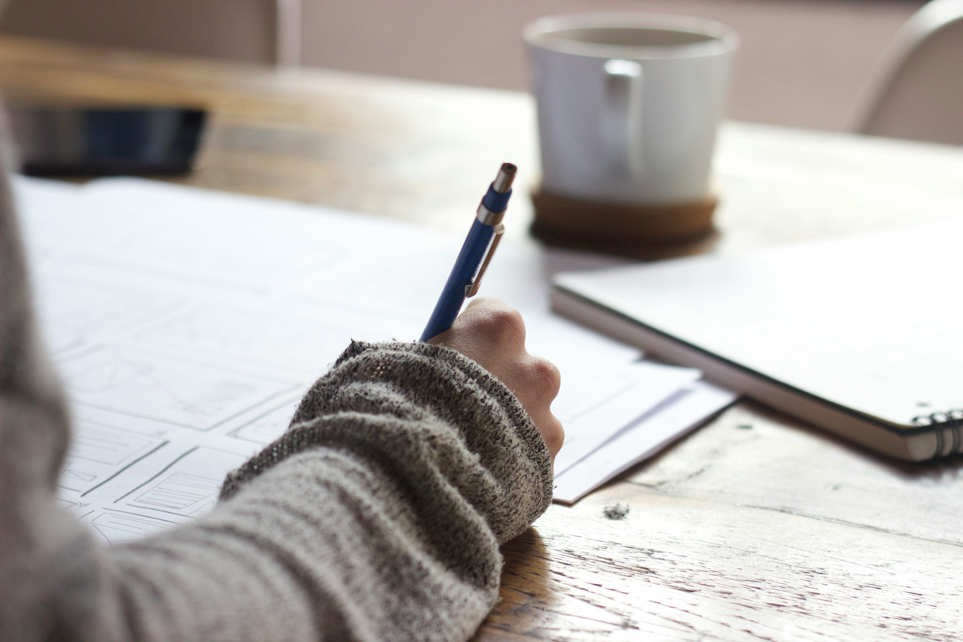 Person Holding Orange Pen